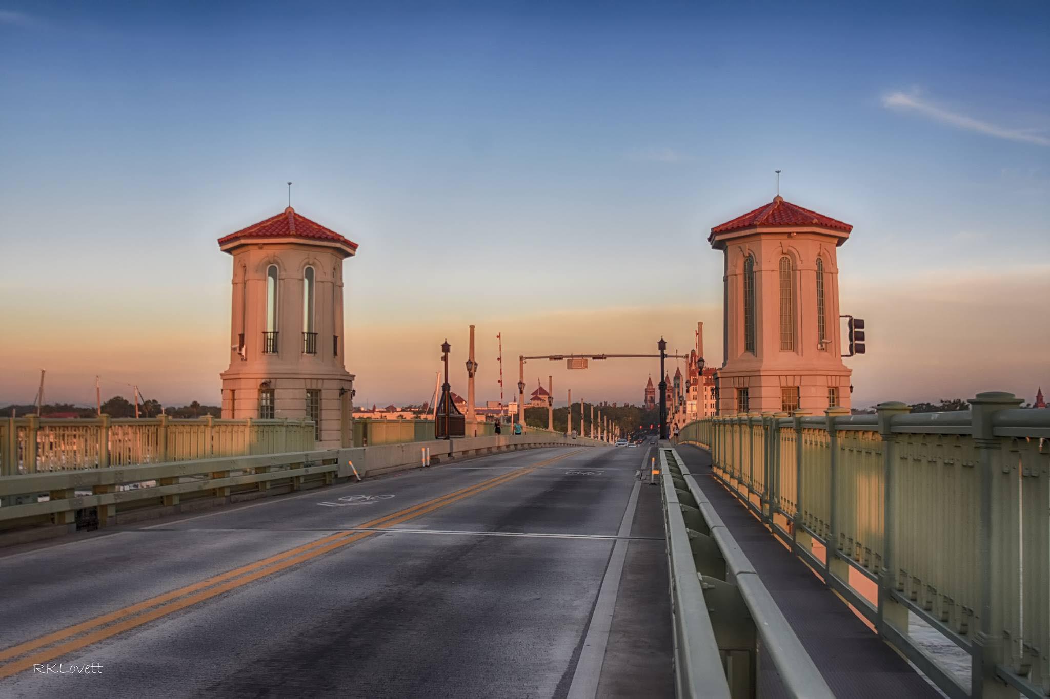 Historic bridge and towers at sunset